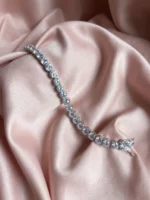 Asteria Solitare Bracelet with pink background